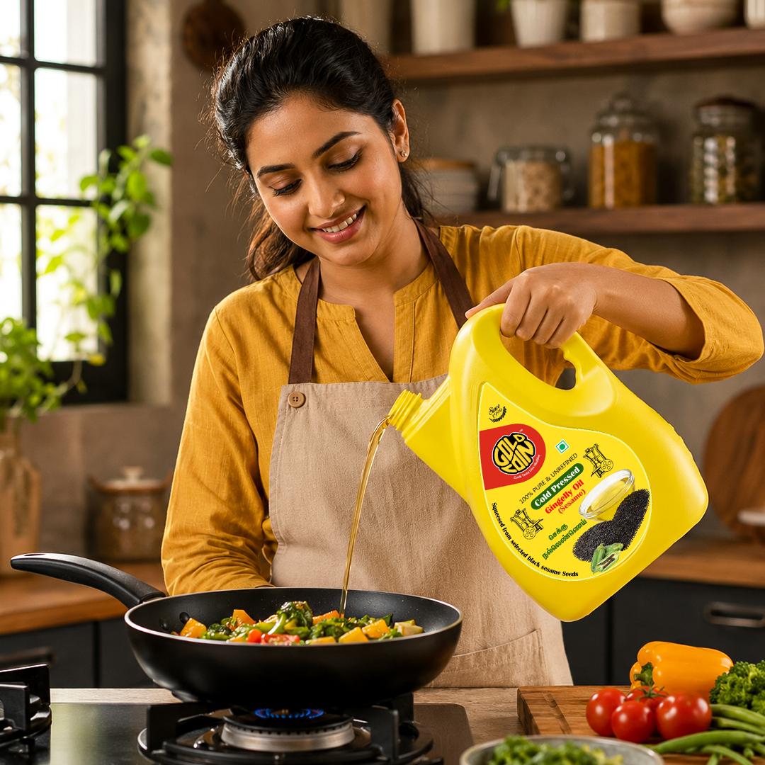 South Indian mother cooking traditional recipes using GOLD COIN cold pressed gingelly sesame oil 5 litre pack